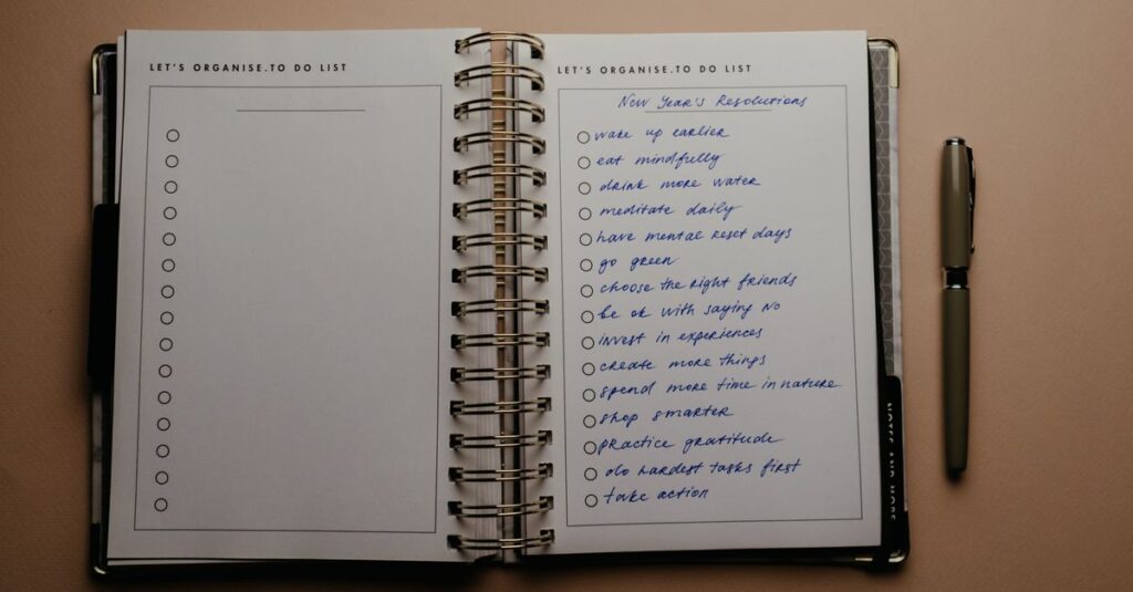 Open planner with New Year's resolutions, spiral binding, and pen on warm-toned background.