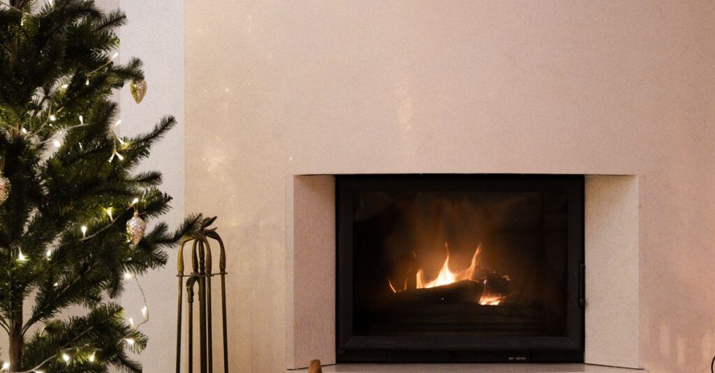 Warm festive interior with a Christmas tree and fireplace setting the holiday mood.