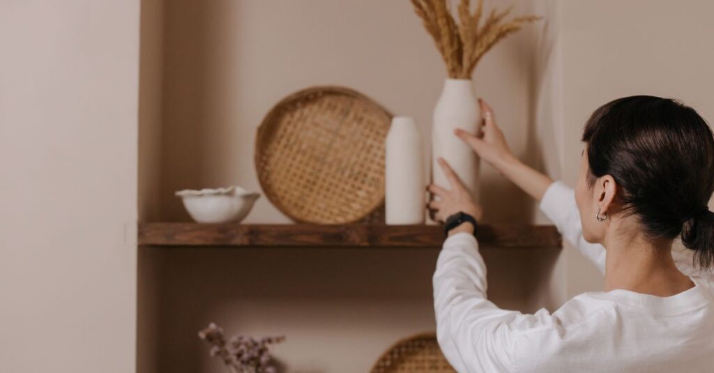 A woman arranging vases on a rustic shelf, highlighting minimalist interior design.